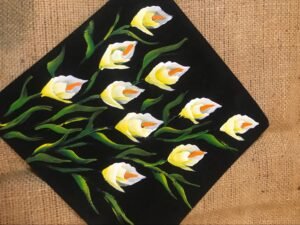 Yellow tulips at  Black cloth