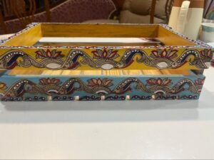 Madhubani patterns at wooden tray