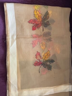 Maple leaves at big stole of organza